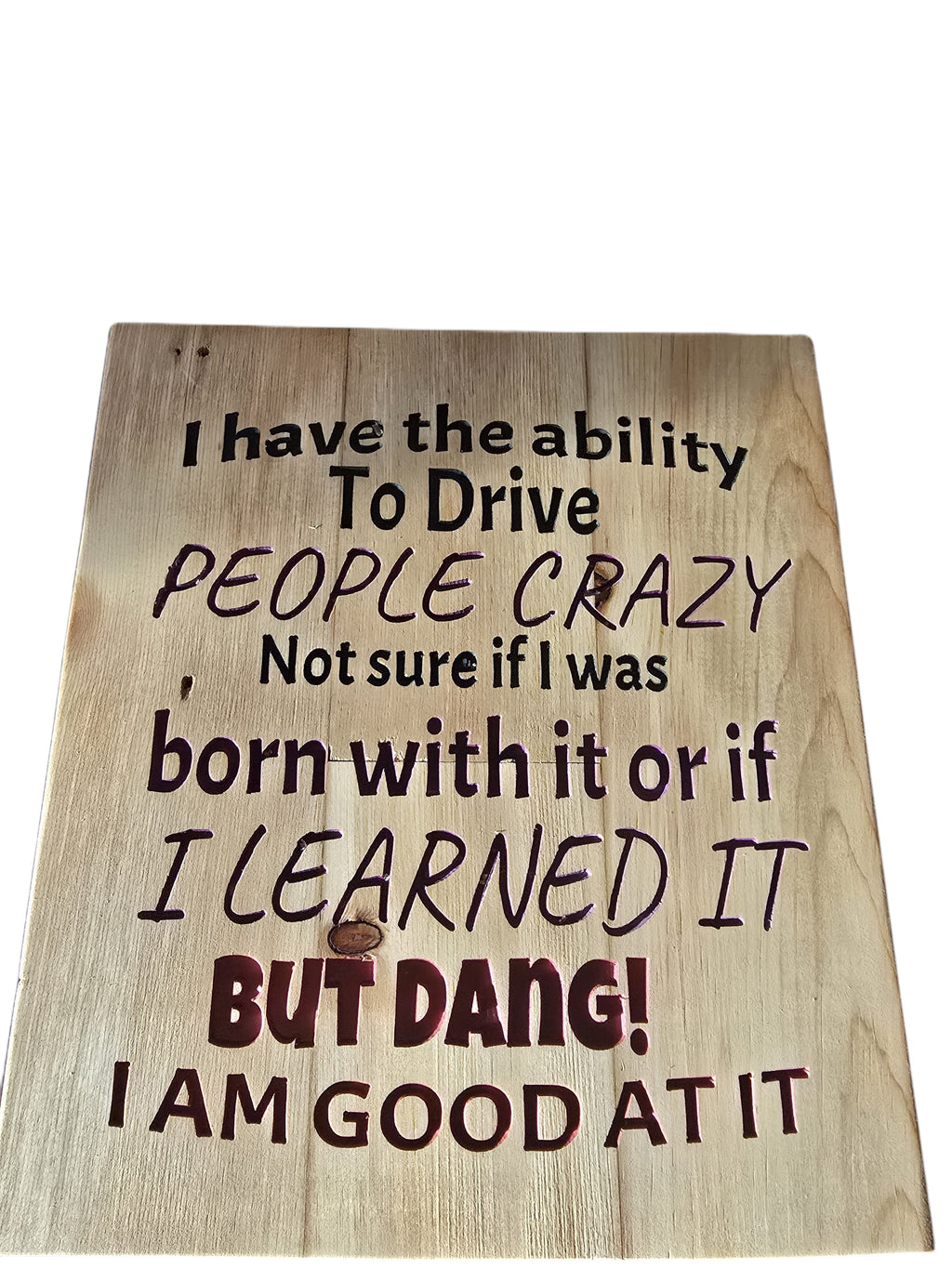 TK Wood Designs reclaimed wood sign with carved text: "I have the ability to drive people crazy, not sure if I was born with it or if I learned it BUT DANG! I AM GOOD AT IT."
