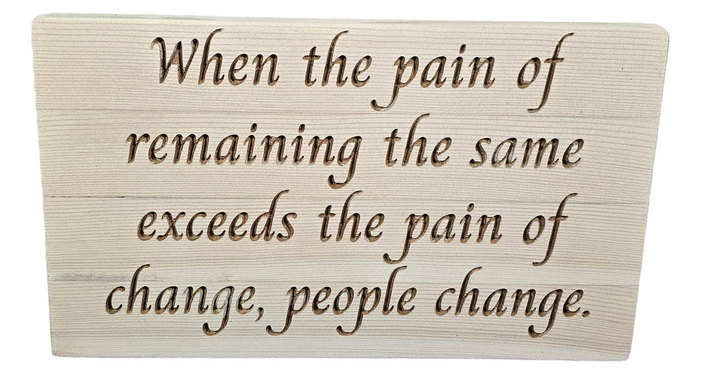 TK Wood Designs reclaimed wood sign with carved quote: "When the pain of remaining the same exceeds the pain of change, people change."