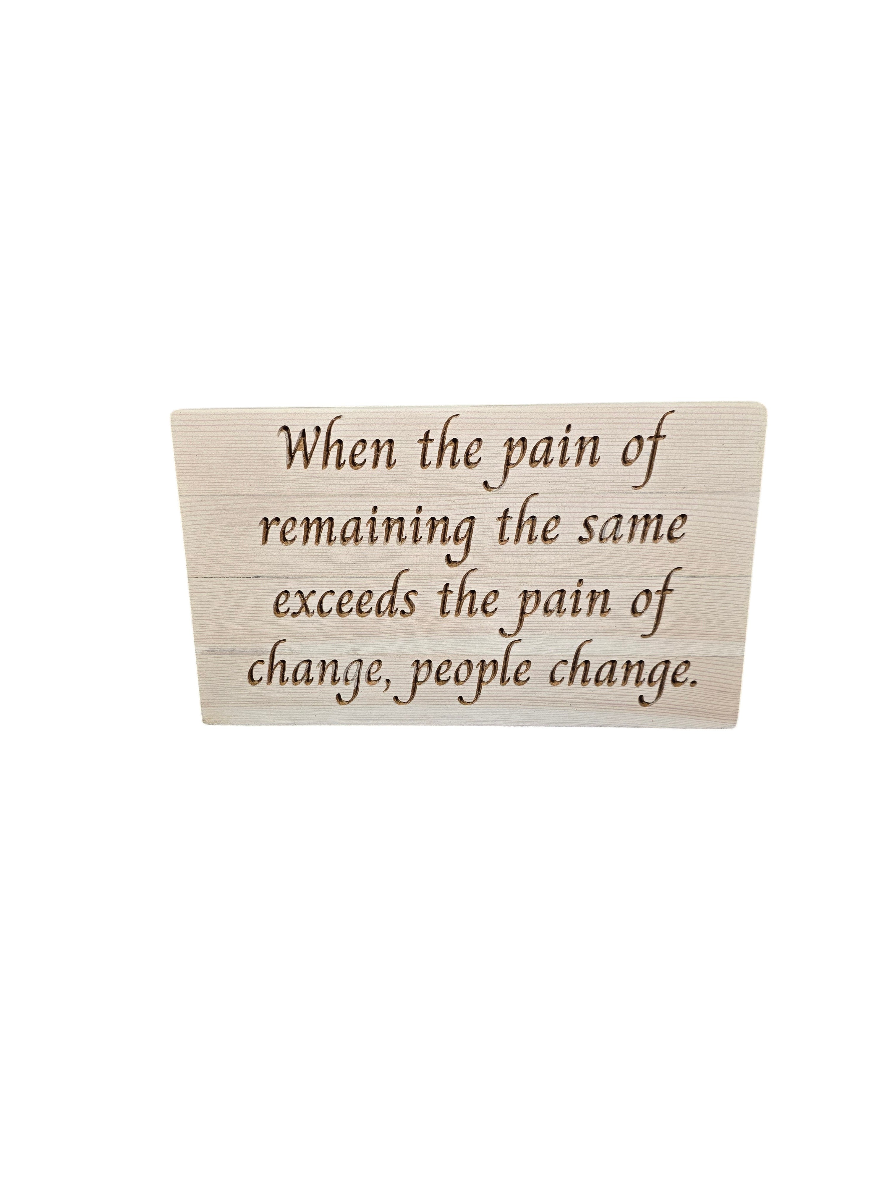 TK Wood Designs reclaimed wood sign with engraved quote: "When the pain of remaining the same exceeds the pain of change, people change."