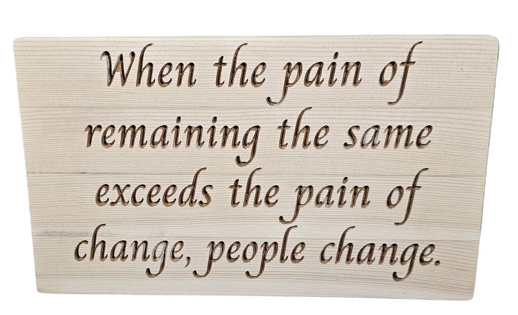 TK Wood Designs reclaimed wood sign with carved quote "When the pain of remaining the same exceeds the pain of change, people change."