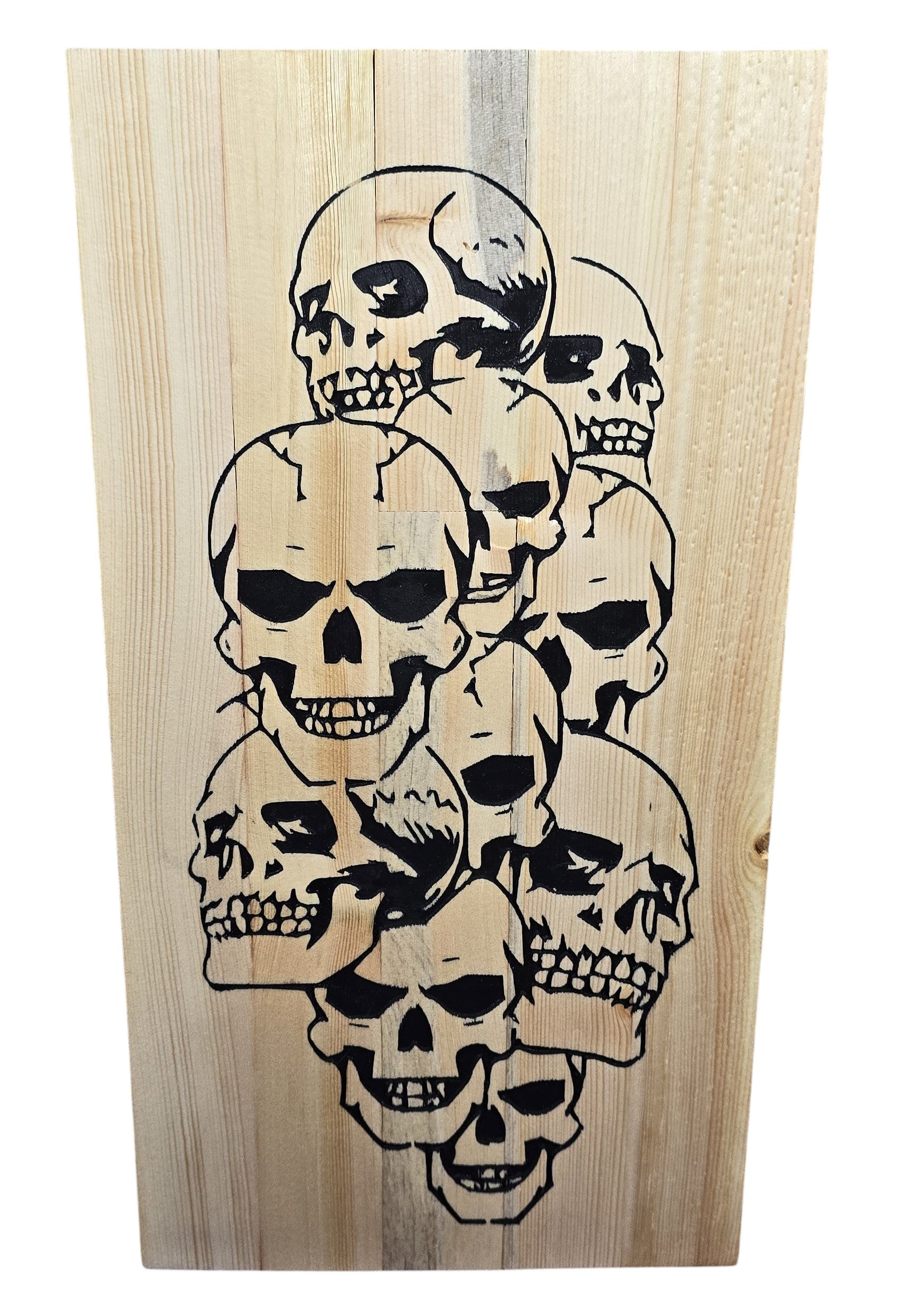 TK Wood Designs handcrafted reclaimed wood sign featuring a cluster of black skulls. Natural wood grain and patina visible.