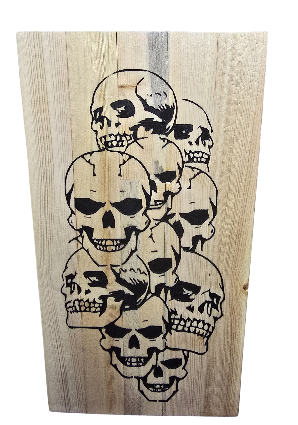TK Wood Designs reclaimed wood sign featuring a graphic of stacked black skulls. Natural wood grain and texture visible.