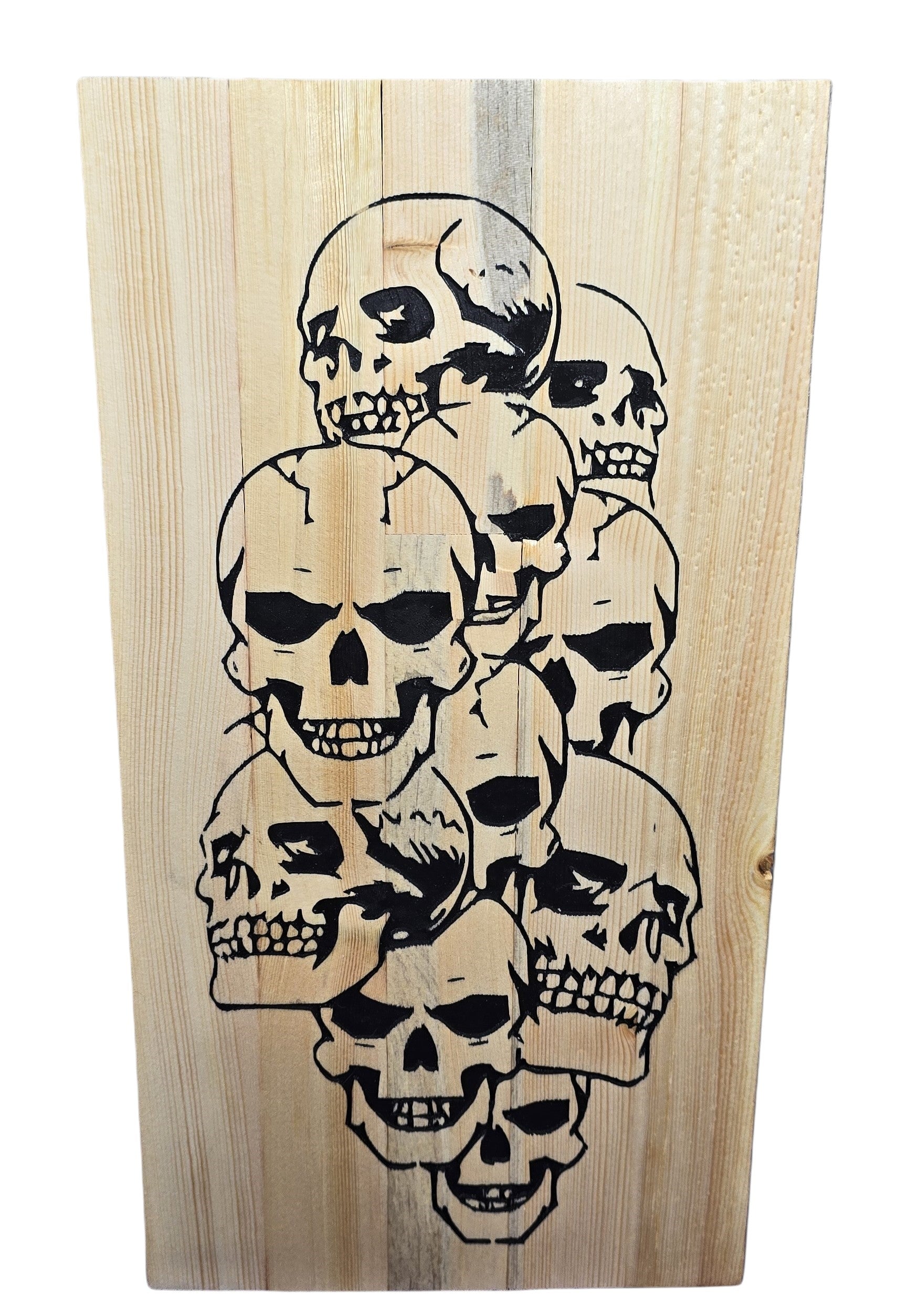 TK Wood Designs reclaimed wood skull sign, featuring a cluster of black-outlined skulls with distressed details.