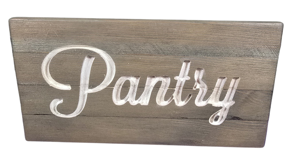 TK Wood Designs rustic wooden pantry sign with carved white script lettering. Natural wood finish.