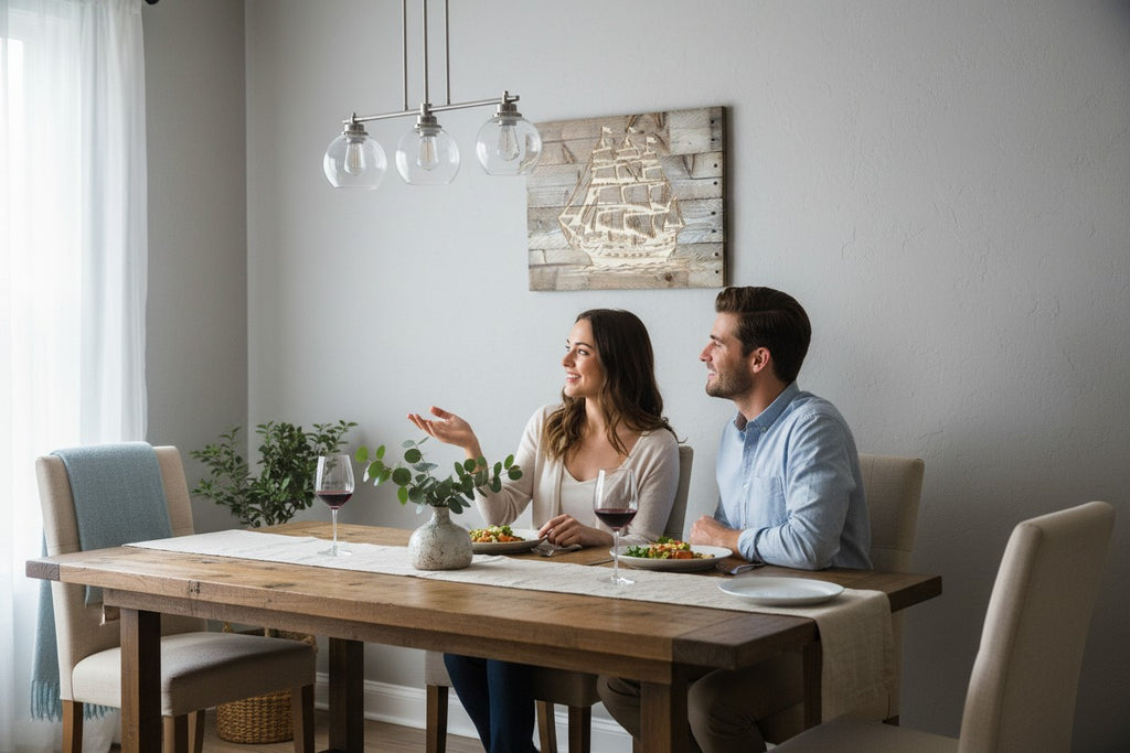 TK Wood Designs rustic wooden ship wall art hanging in a dining room above a couple eating dinner.