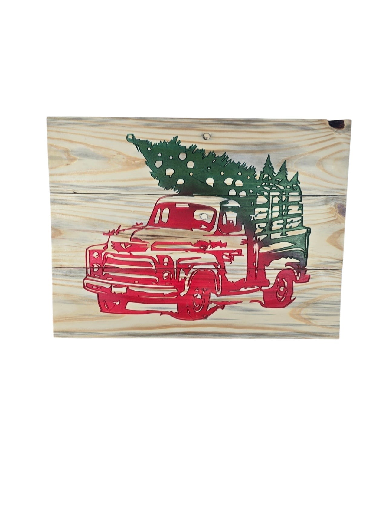 TK Wood Designs rustic wooden wall art featuring a red vintage truck hauling a green Christmas tree on wood grain.