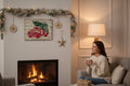TK Wood Designs rustic wooden wall art featuring a vintage red truck with a Christmas tree hanging above a fireplace.