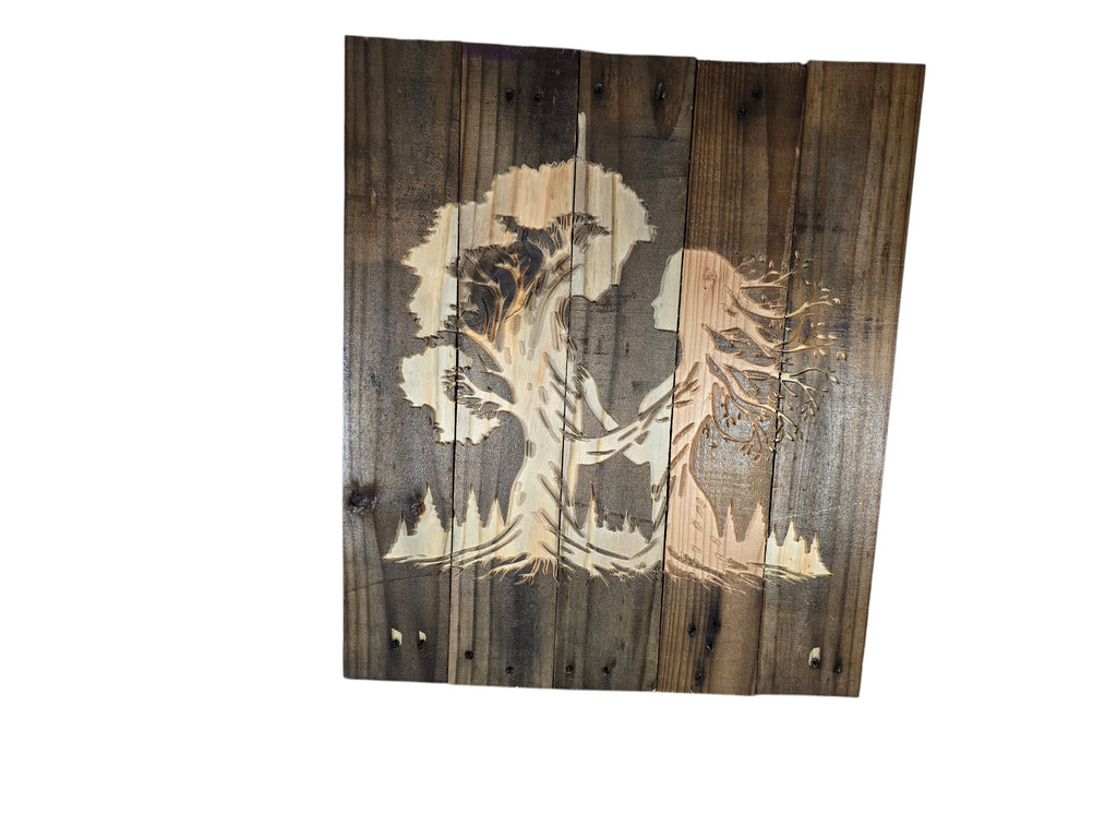 TK Wood Designs handcrafted rustic wall art featuring a laser-engraved silhouette of a person and tree on reclaimed wood.