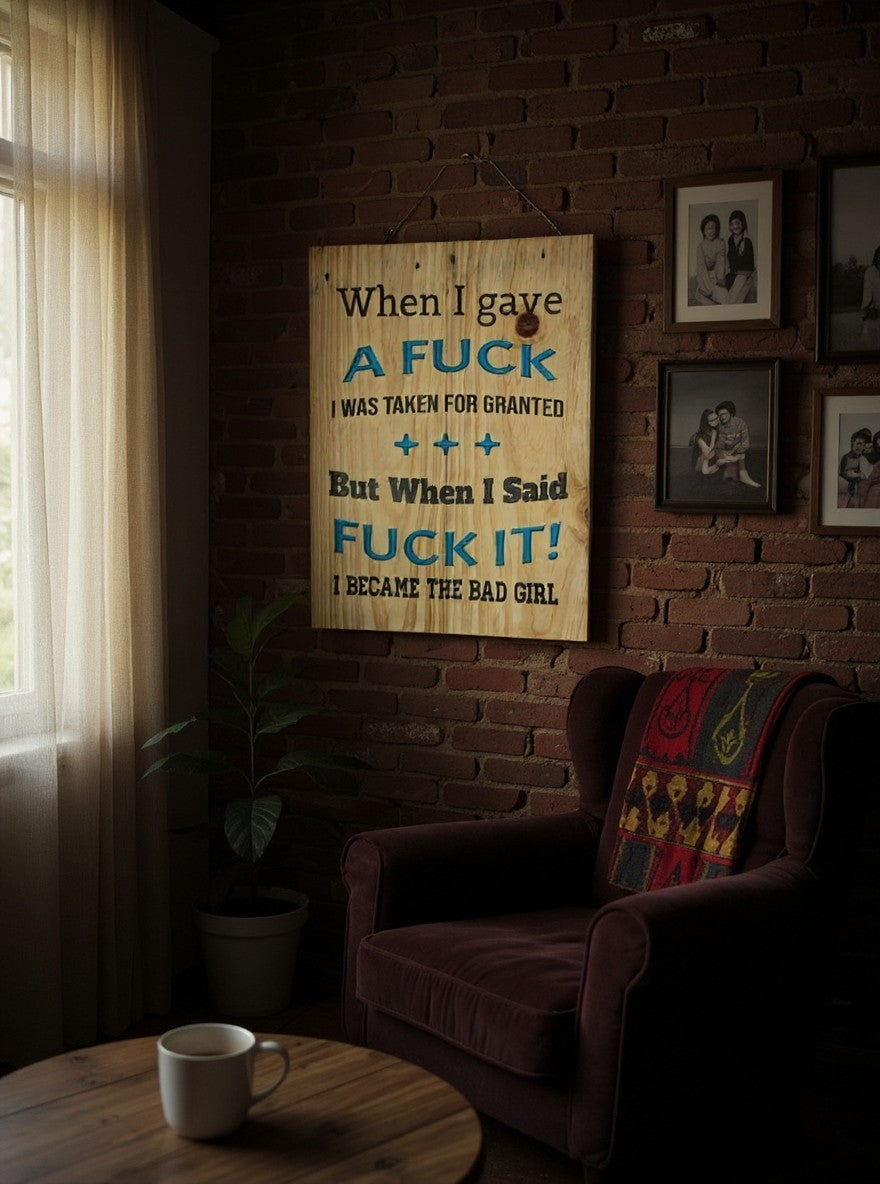 TK Wood Designs rustic wooden wall sign with sassy quote in black and blue lettering hanging on a brick wall