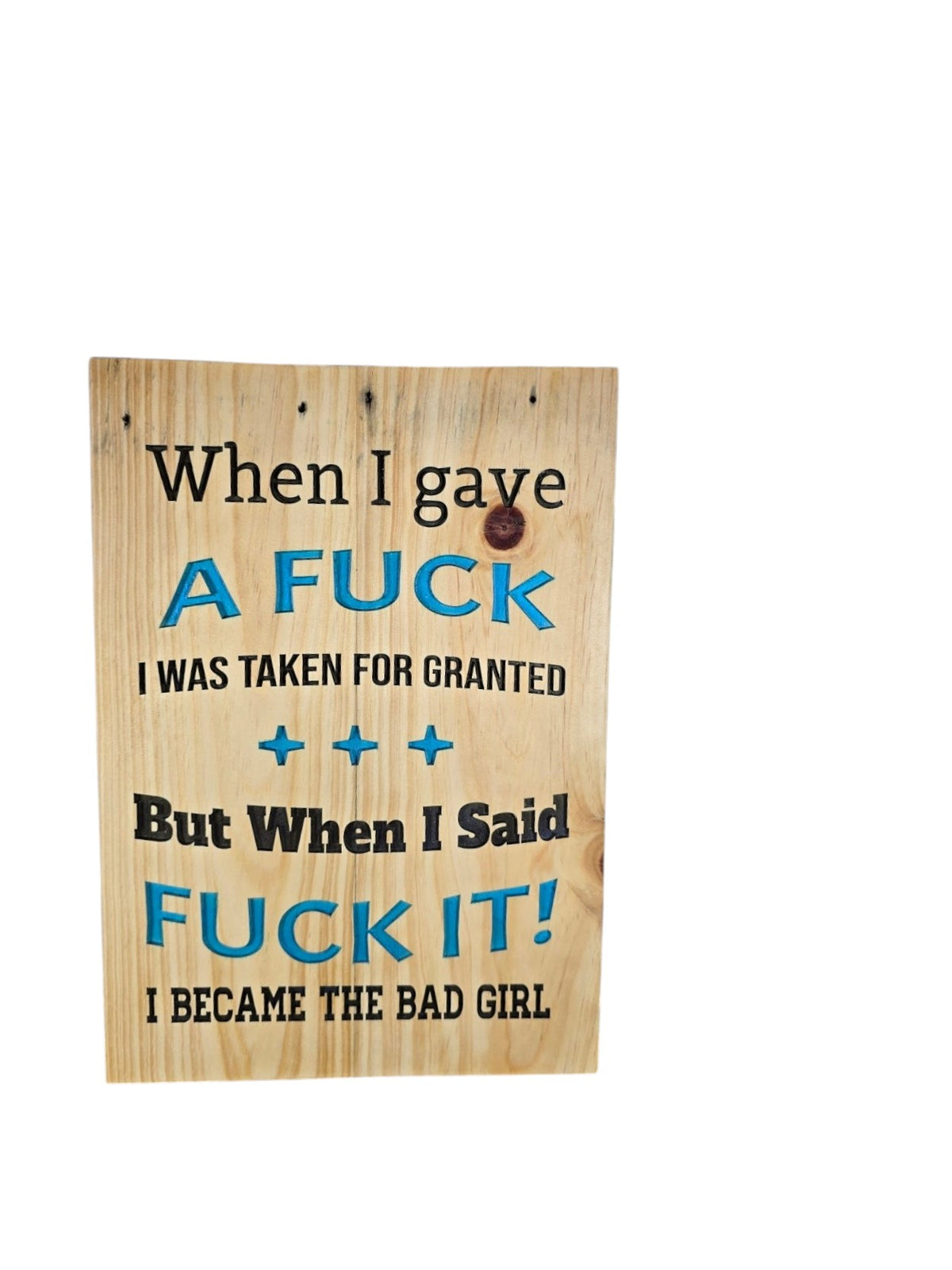 TK Wood Designs rustic wooden wall sign with black and blue sassy quote text on a natural wood grain background.