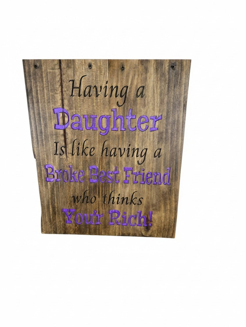 TK Wood Designs rustic wooden sign with purple text reading Having a Daughter Is like having a Broke Best Friend