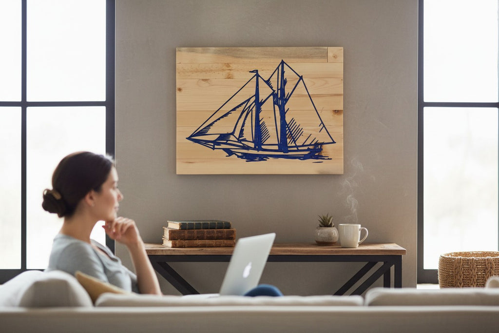 TK Wood Designs blue sailboat wood wall art with detailed rigging and sails on a light wood plank background.