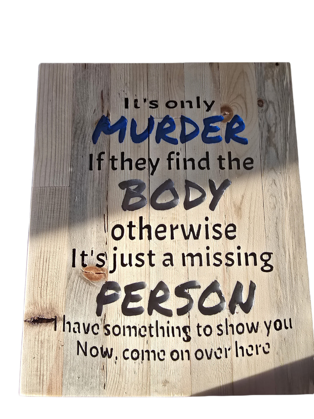 TK Wood Designs salvaged wood sign with humorous text about murder and missing persons. Features distressed wood and bold lettering.