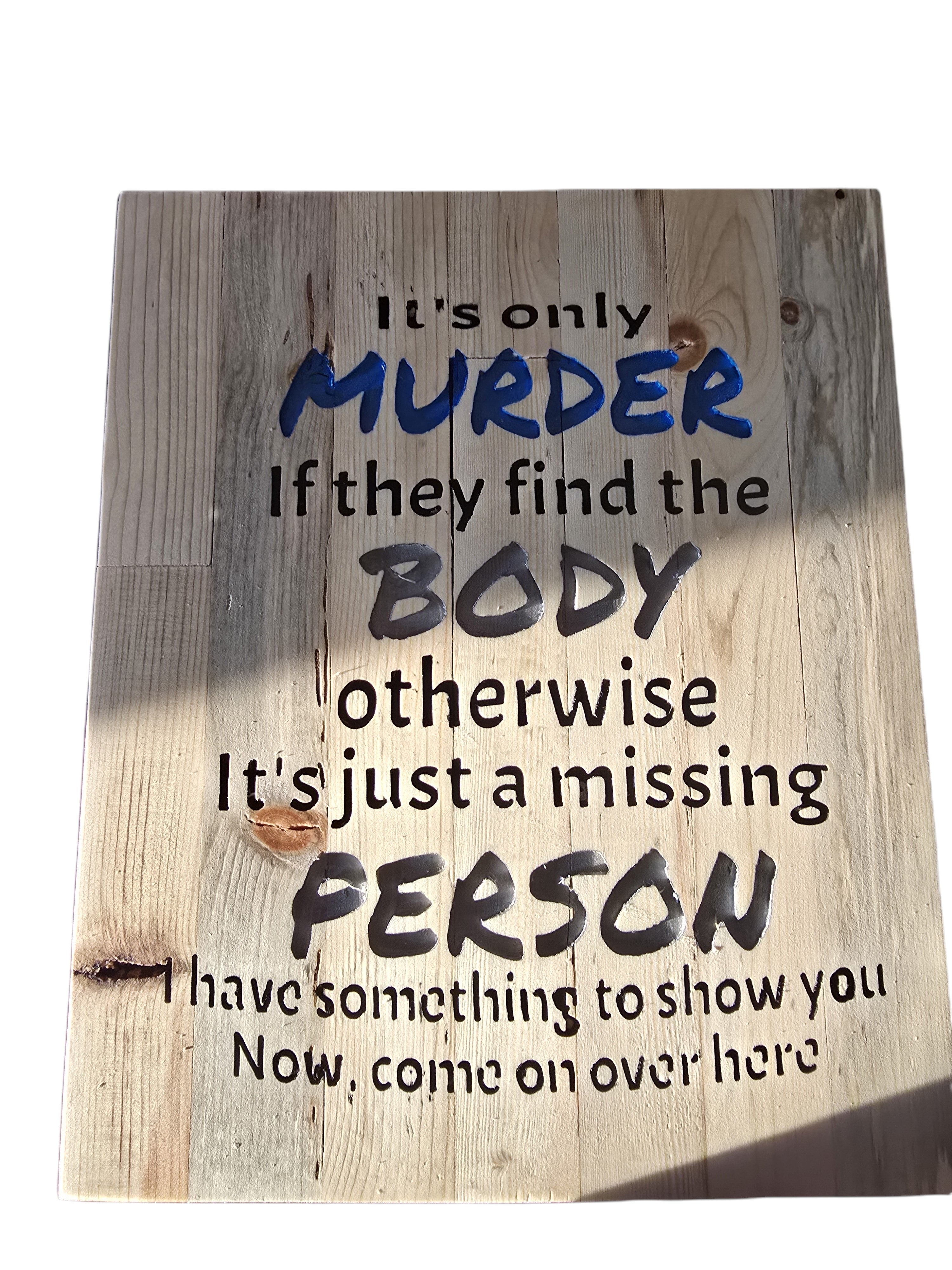 TK Wood Designs salvaged wood sign with humorous text about murder and missing persons. Features distressed wood and bold lettering.
