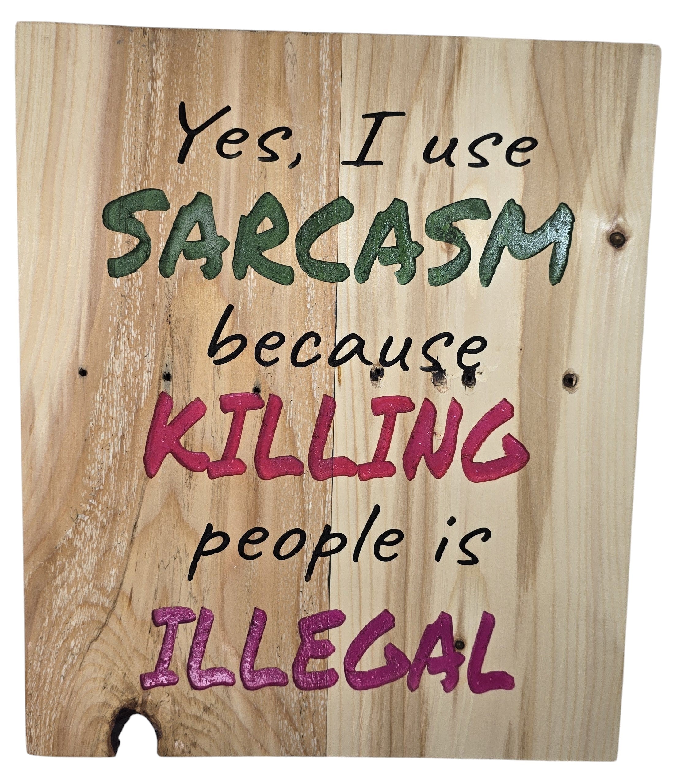 TK Wood Designs natural wood sign with bold green, pink, and black lettering that reads "Yes, I use SARCASM because KILLING people is ILLEGAL."