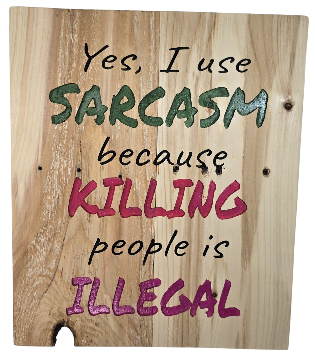 TK Wood Designs natural wood sign with bold green and pink lettering that reads "Yes, I use SARCASM because KILLING people is ILLEGAL."