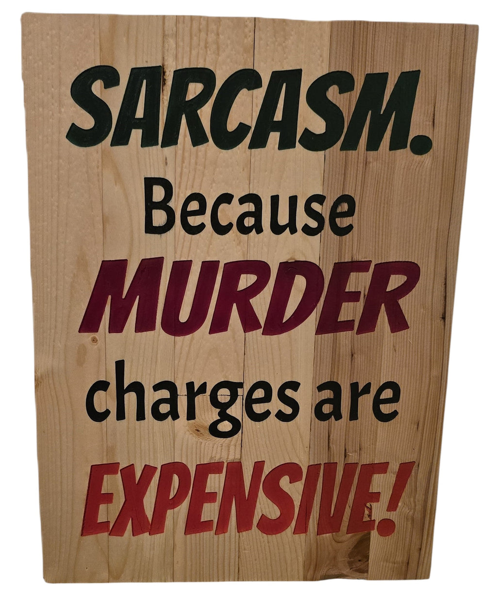 TK Wood Designs natural wood sign with rustic finish, featuring black and red text that reads "Sarcasm. Because Murder Charges Are Expensive!"