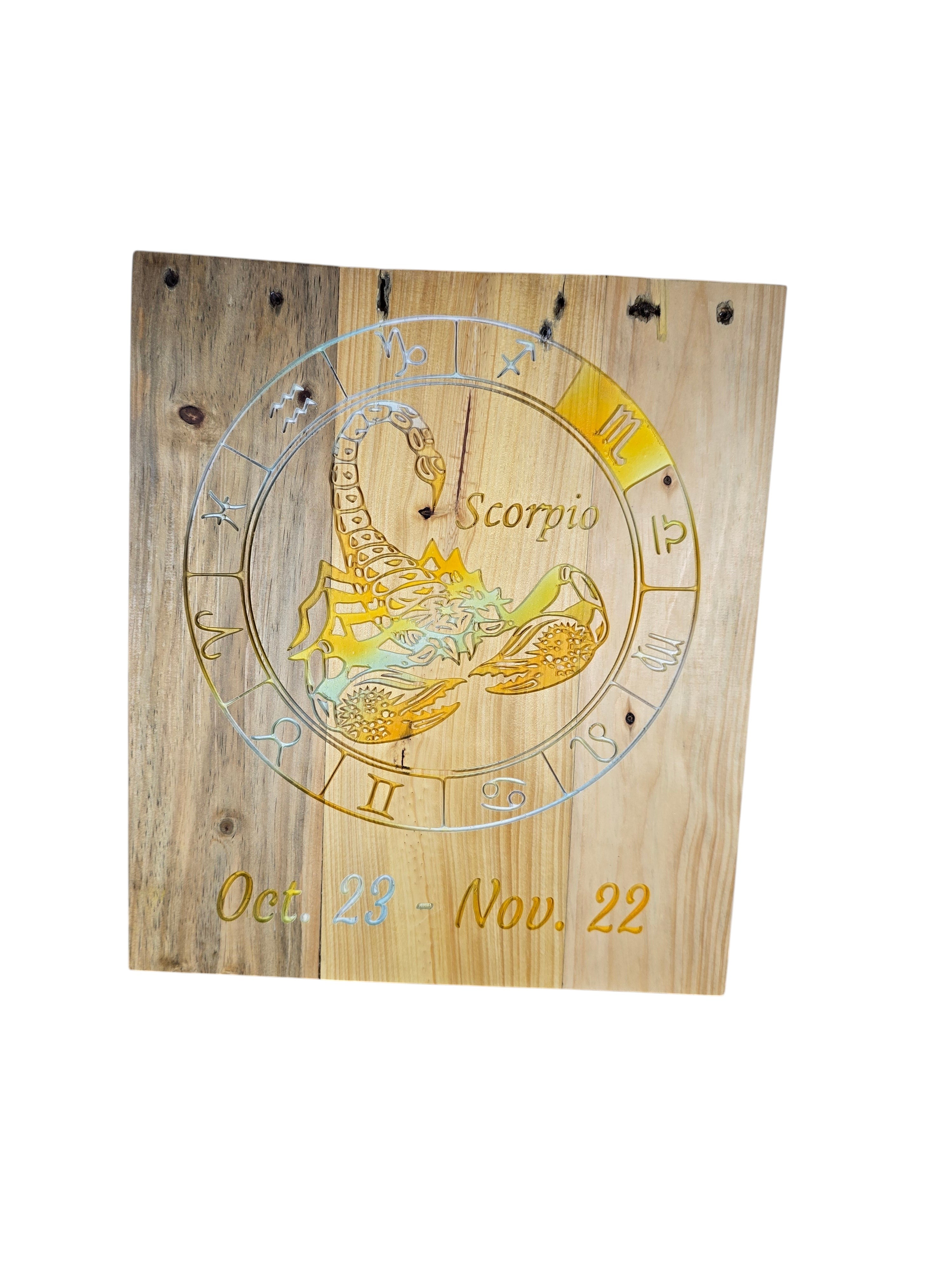 TK Wood Designs Scorpio zodiac sign wall art featuring a laser-engraved scorpion emblem on natural wood grain.