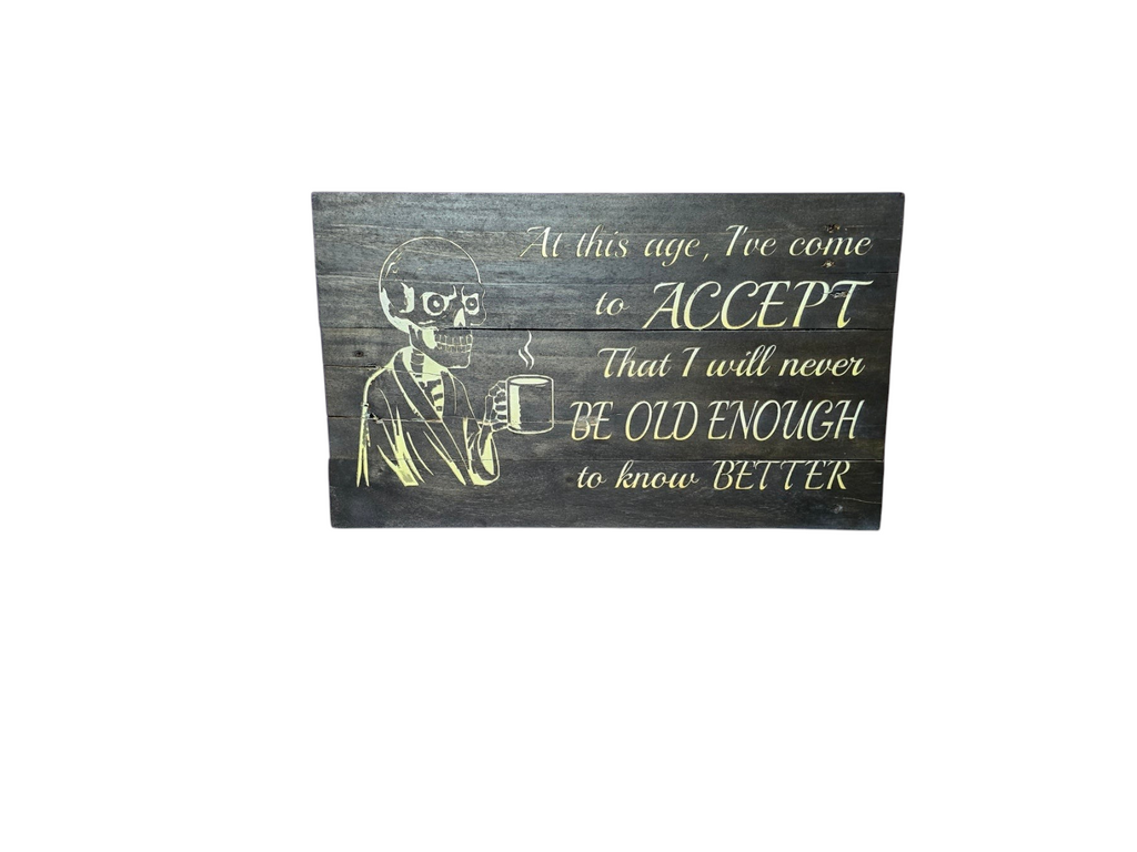 TK Wood Designs rustic wooden wall sign featuring a skeleton drinking coffee and a humorous quote on dark wood planks.