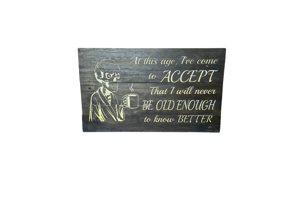 TK Wood Designs rustic wooden wall sign featuring a skeleton drinking coffee and a humorous quote on dark wood planks.