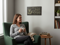 TK Wood Designs rustic wooden wall sign featuring a skeleton with coffee and a humorous quote in a cozy living room.