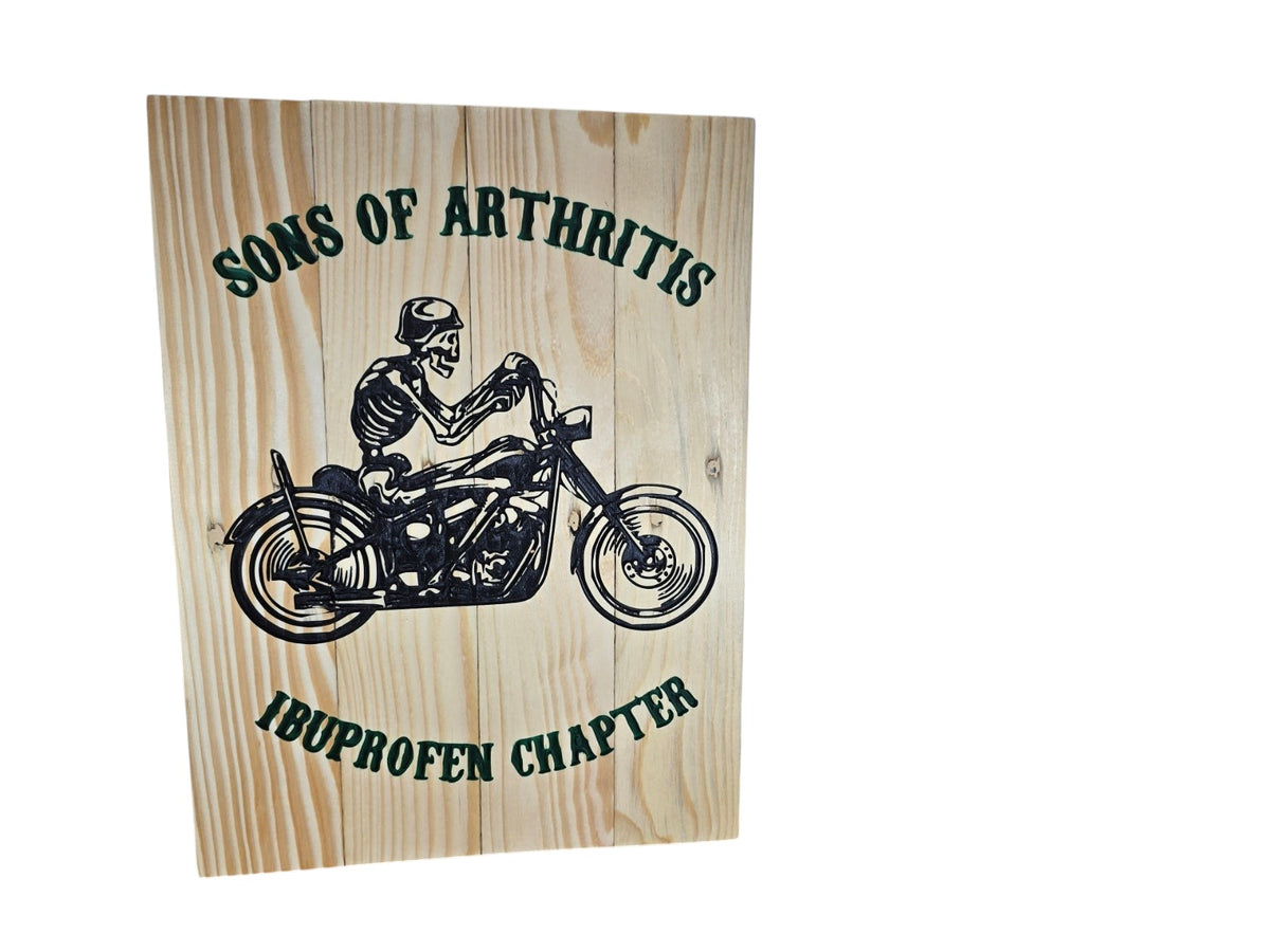 TK Wood Designs wooden sign featuring a skeleton riding a motorcycle with Sons of Arthritis Ibuprofen Chapter text