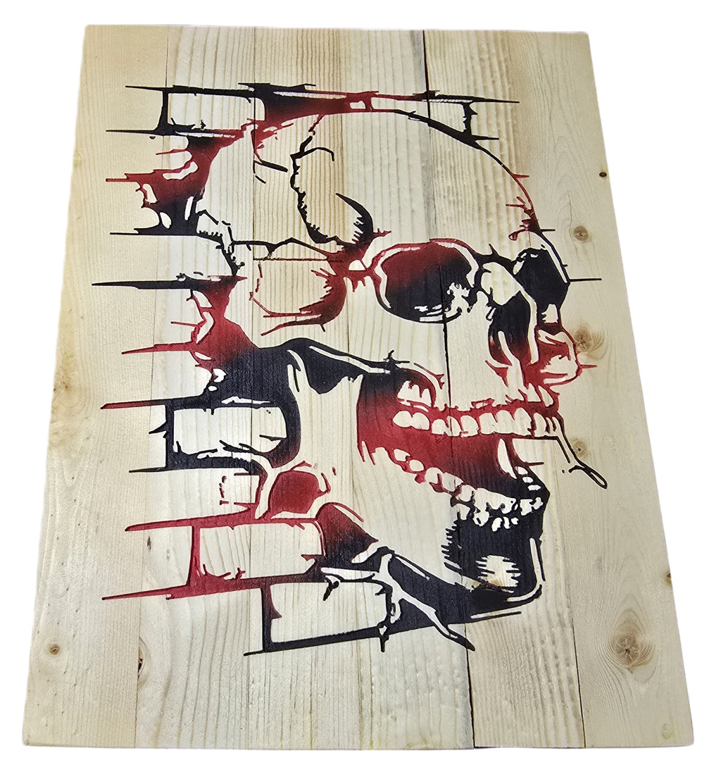 TK Wood Designs rustic skull wood wall art with distressed brick effect in black and red on natural wood planks.