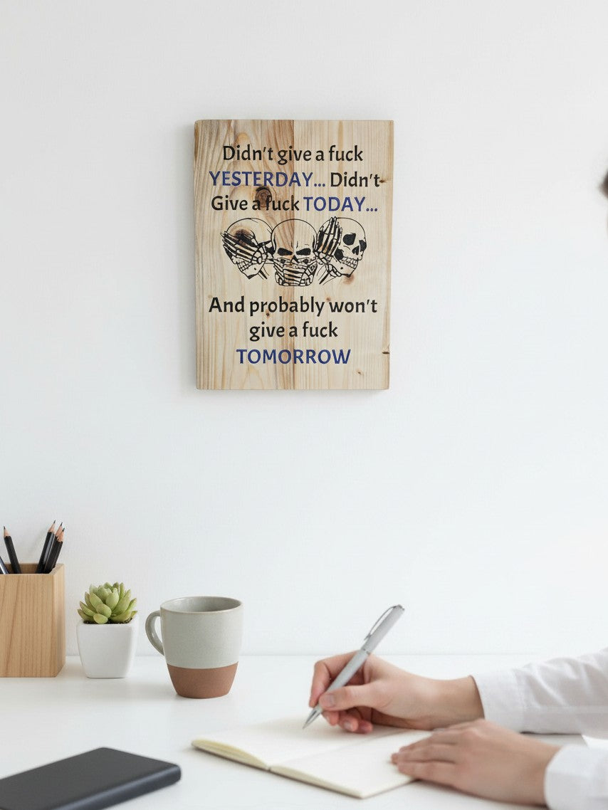 TK Wood Designs wooden wall sign featuring three skulls and bold text with blue accents on a rustic wood background.