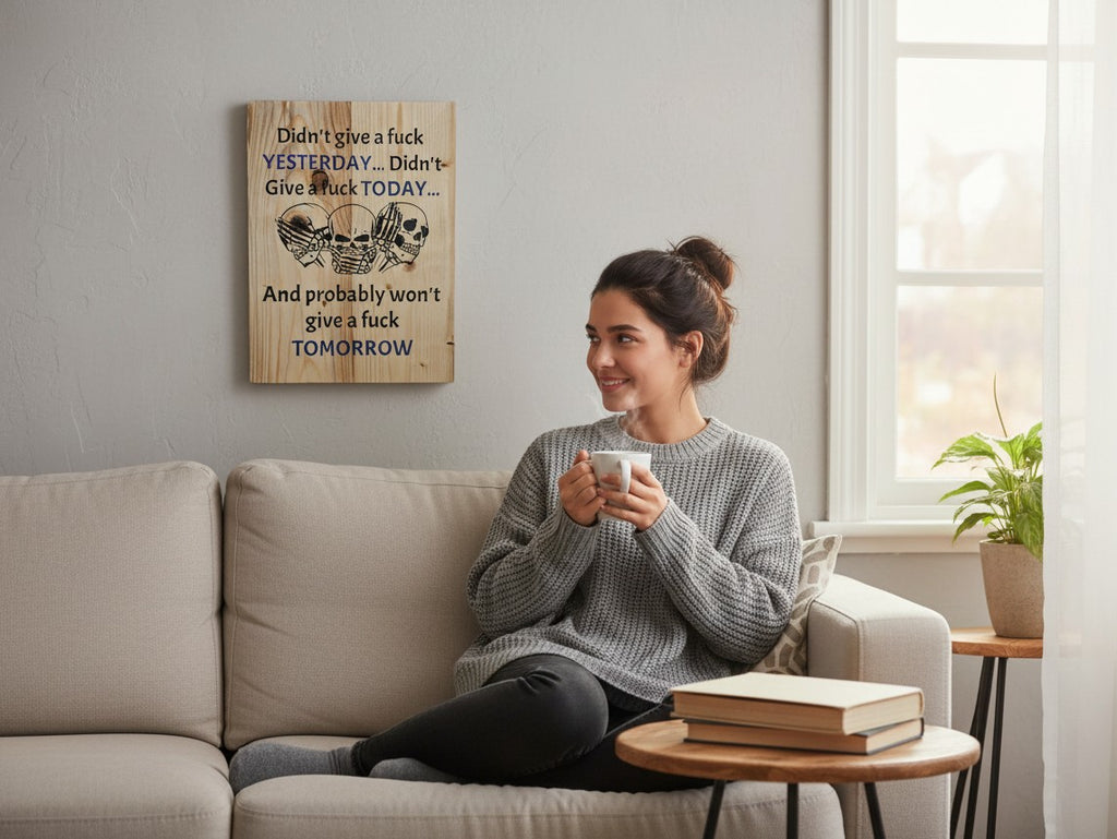 TK Wood Designs rustic wooden wall sign with skull illustration hanging above a woman sitting on a beige sofa.