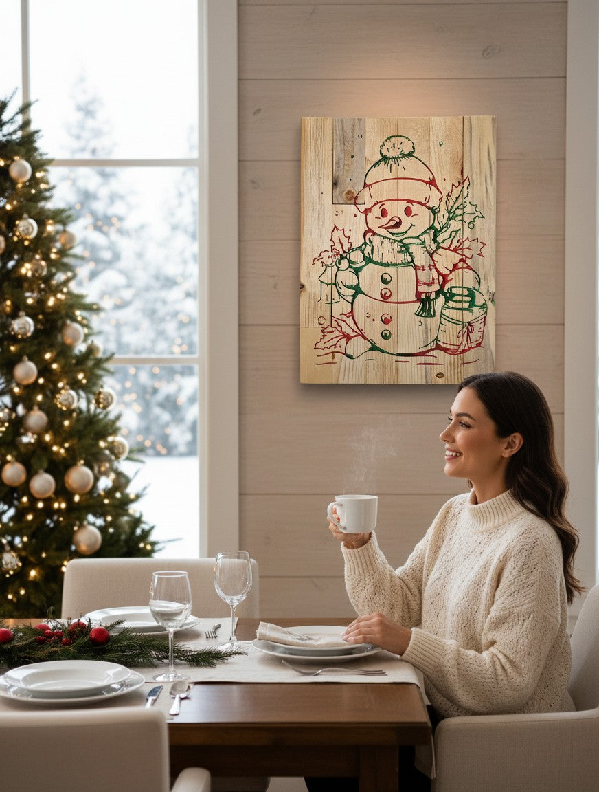 TK Wood Designs snowman sign hand-painted on reclaimed wood with red and green details, featuring snowflakes and holly.