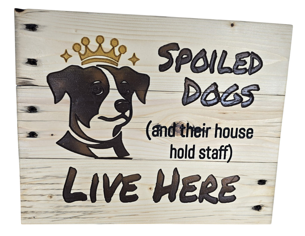 TK Wood Designs natural wood sign with a dog wearing a crown and the text "Spoiled Dogs (and their house hold staff) LIVE HERE."