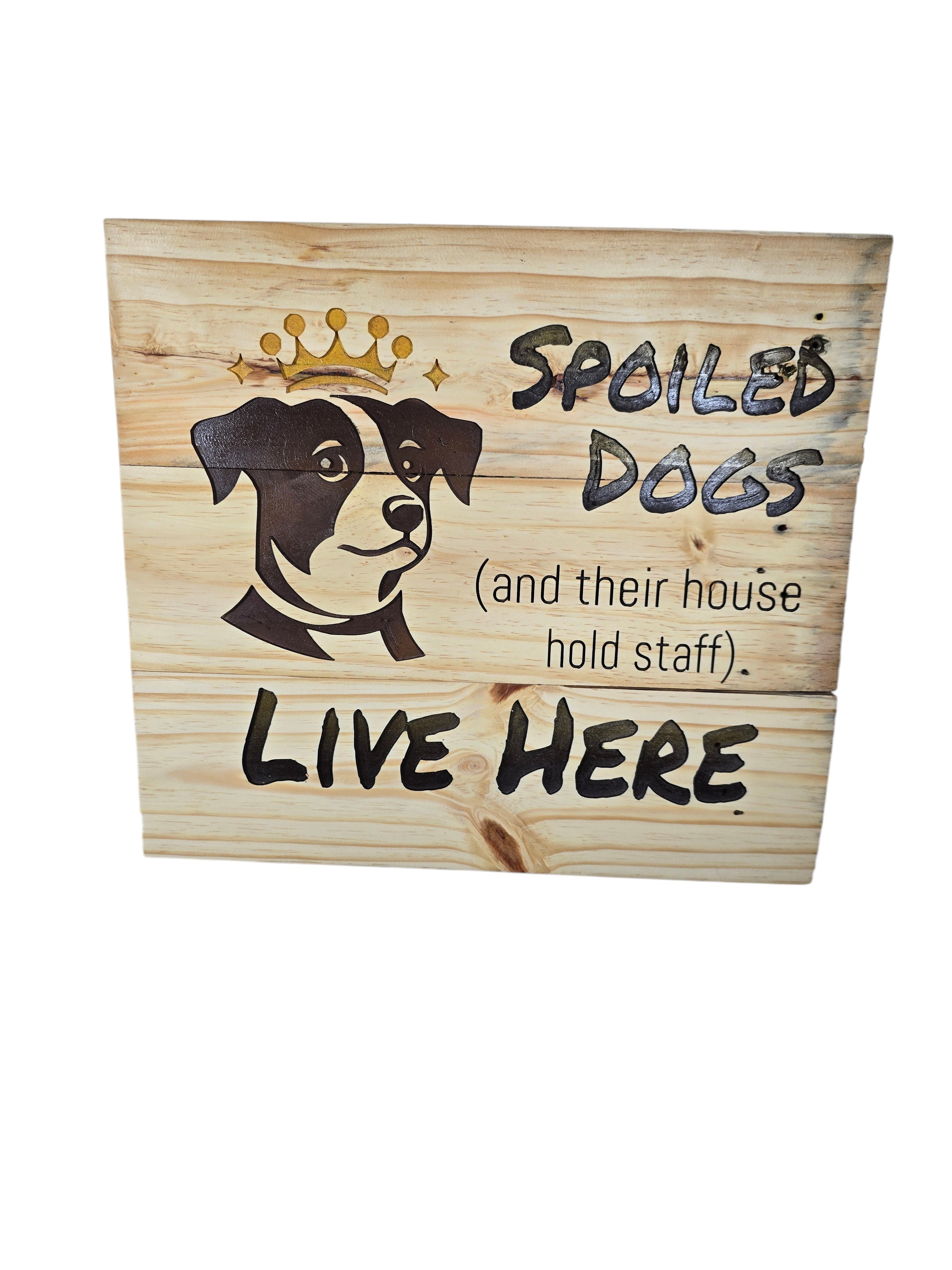 TK Wood Designs natural wood plank sign with a dog wearing a crown graphic and text: Spoiled Dogs Live Here.