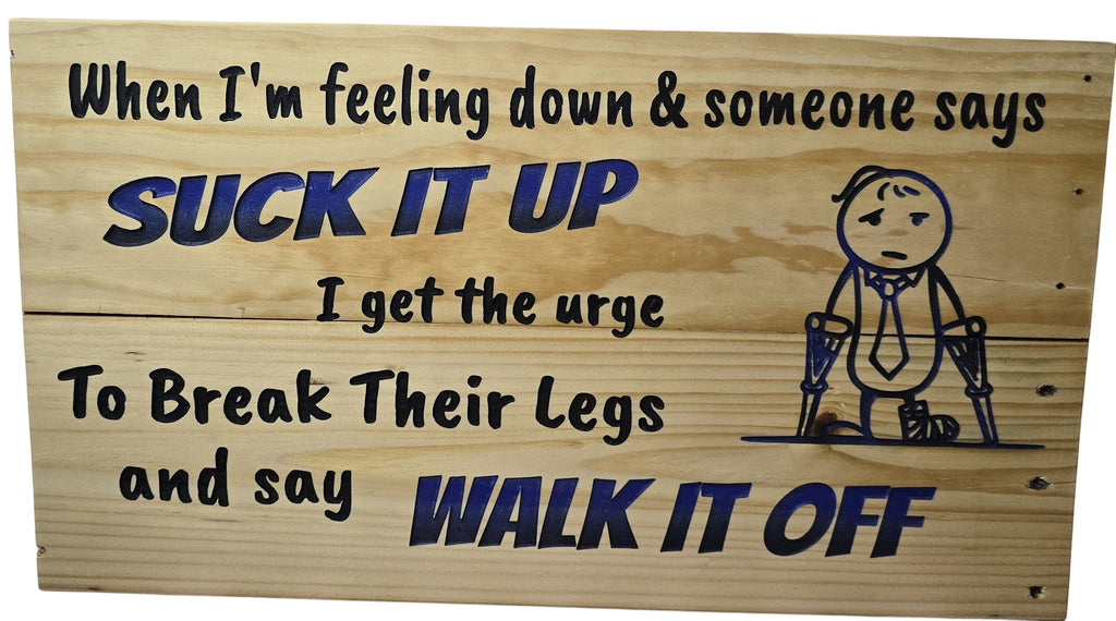 TK Wood Designs humorous wood sign with blue lettering saying "Suck It Up Walk It Off" and a stick figure with crutches.
