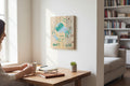 TK Wood Designs Taurus zodiac sign wall art featuring a bull illustration on natural wood hanging in a home office.