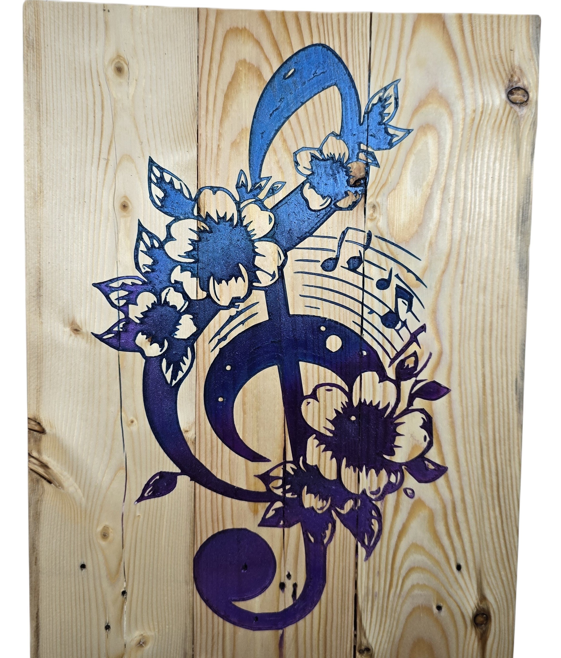 TK Wood Designs blue and purple treble clef with floral and musical notes on natural wood.