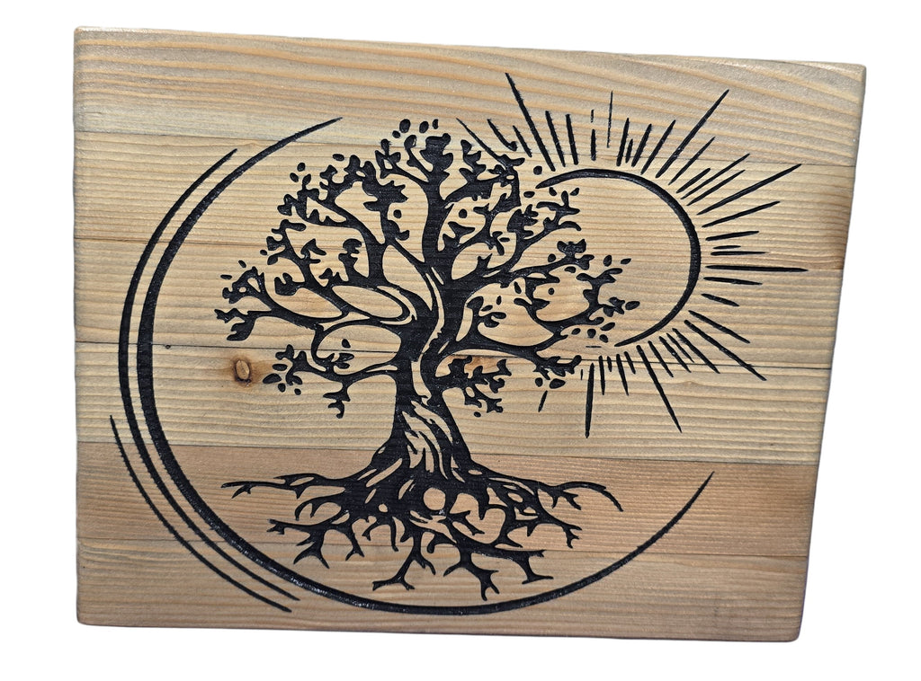 TK Wood Designs handcrafted reclaimed wood sculpture of a black Tree of Life with sun and crescent moon motif.