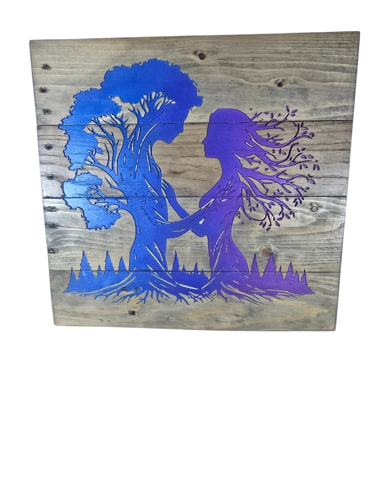 TK Wood Designs handcrafted wooden wall art featuring a blue and purple gradient tree spirit silhouette on rustic wood.