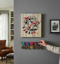 TK Wood Designs USMC bulldog logo carved into salvaged wood. Red and black painted details.