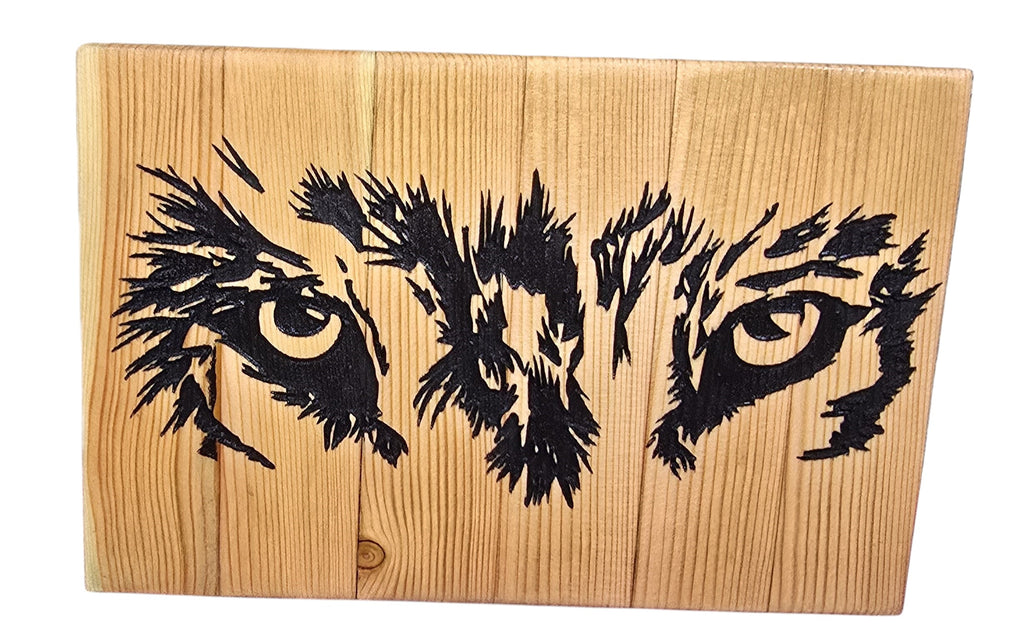 TK Wood Designs Wolf Eyes art on reclaimed wood, featuring a black painted wolf's intense gaze on natural wood grain.