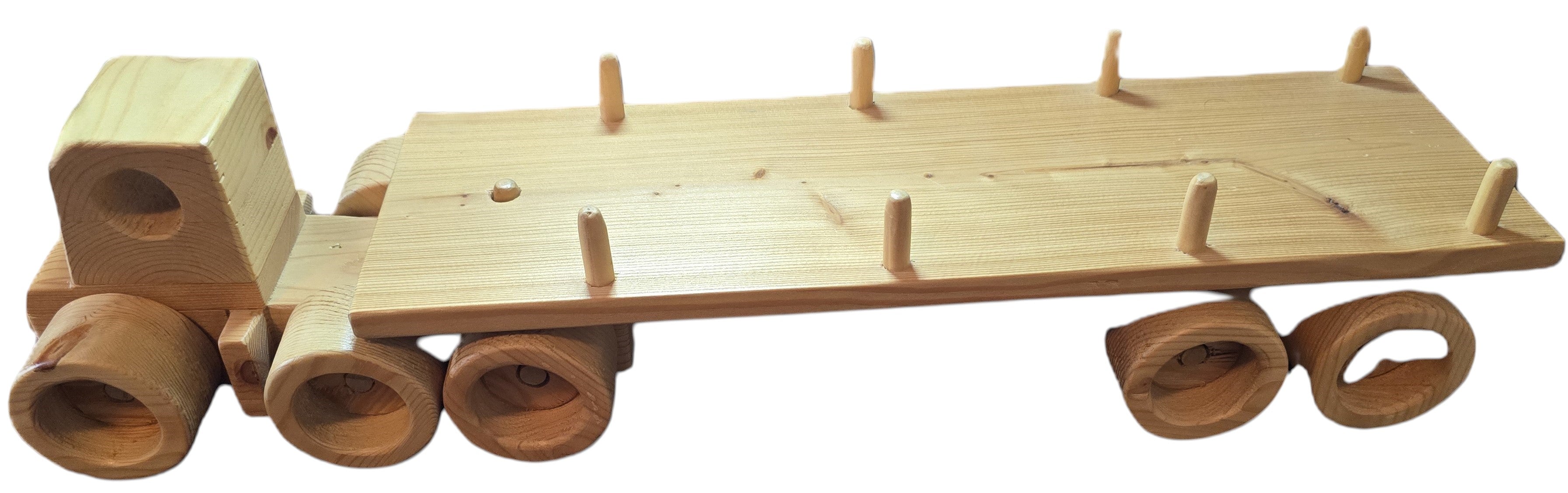 TK Wood Designs natural wood flatbed semi-truck toy with wooden wheels and cargo stakes.