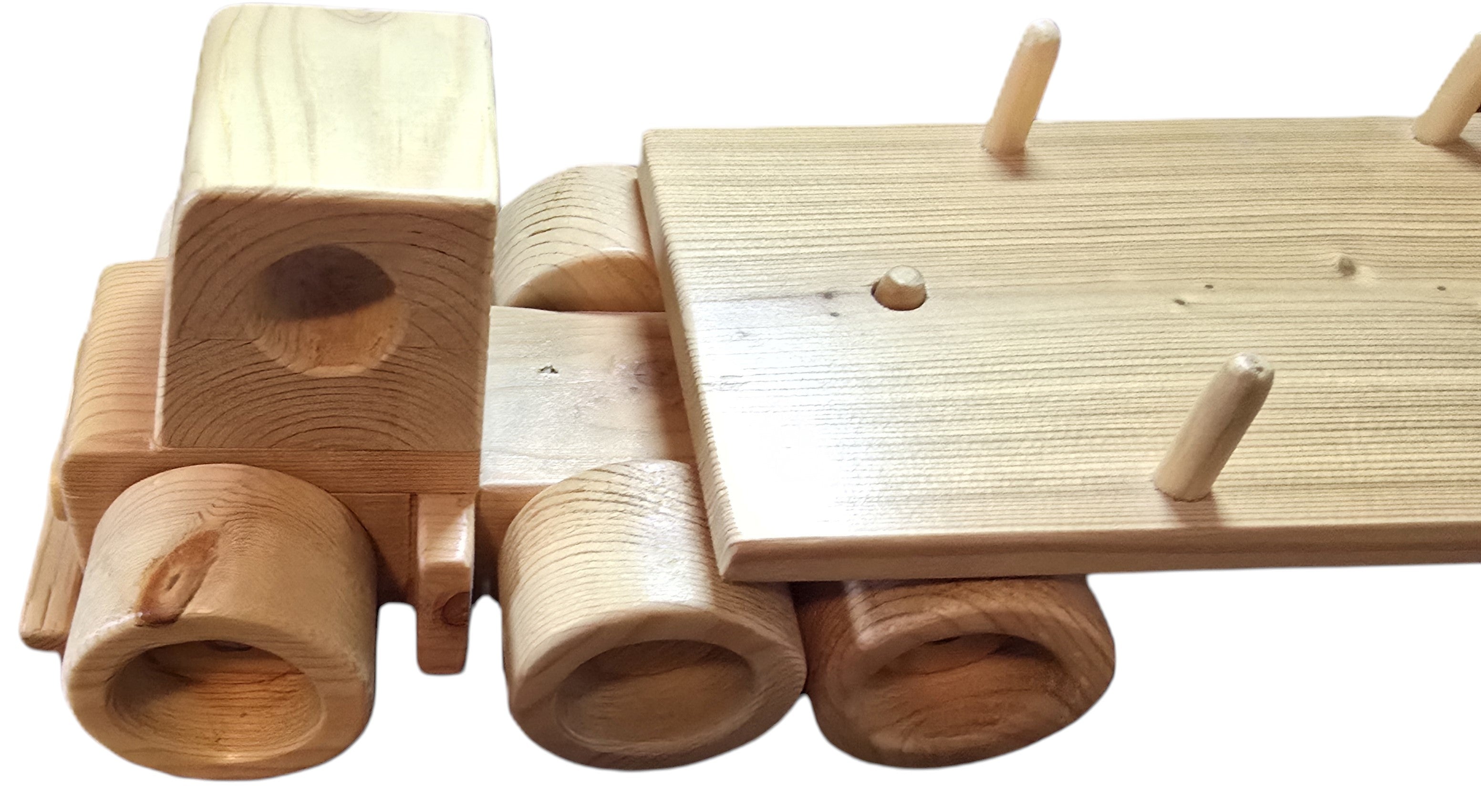 TK Wood Designs natural wood flatbed semi-truck toy with visible wood grain and pegs on the cargo bed.