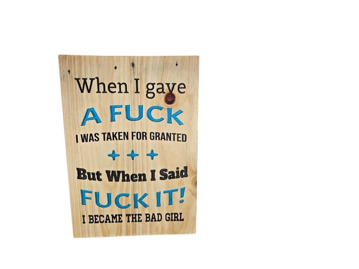 TK Wood Designs wooden sign with black and blue text featuring a humorous quote about becoming the bad girl