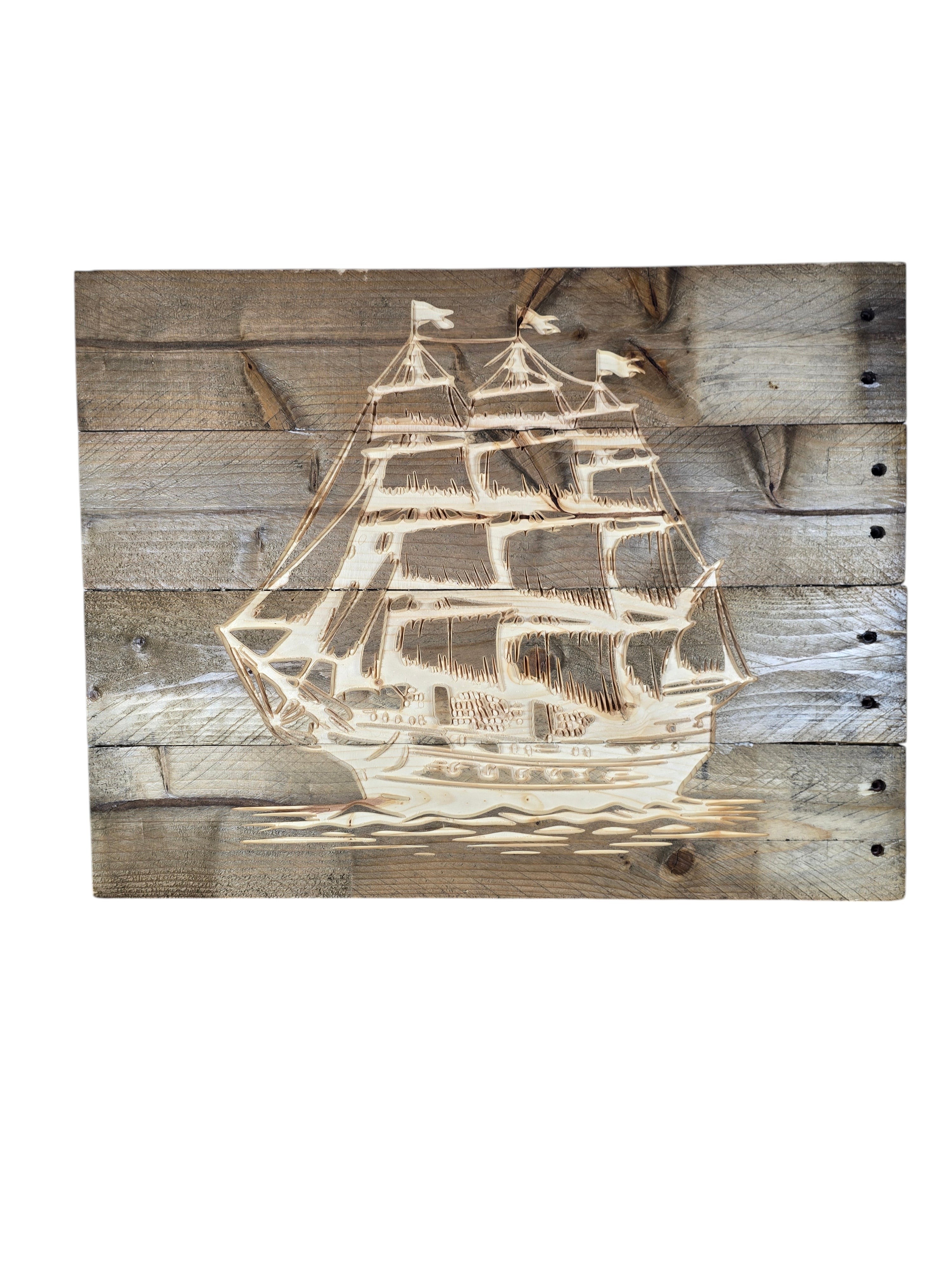 TK Wood Designs rustic wall art featuring a laser-etched sailing ship on weathered reclaimed wood planks.