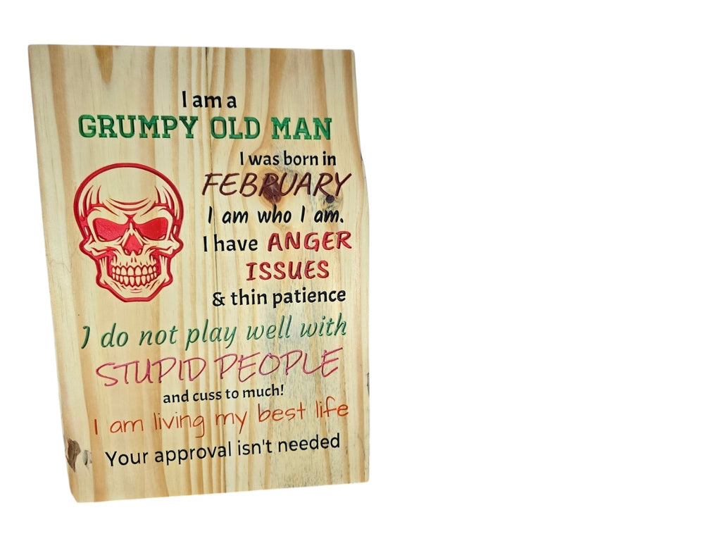 TK Wood Designs wooden sign featuring a skull graphic and humorous text about being a grumpy man born in February.