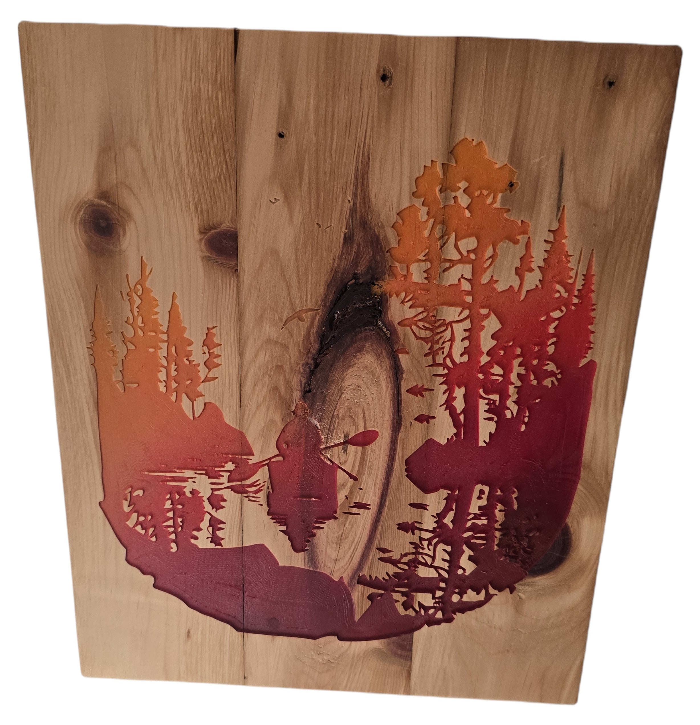 TK Wood Designs rustic woodland scene wall art with kayaker, forest silhouette in orange and red on natural wood.
