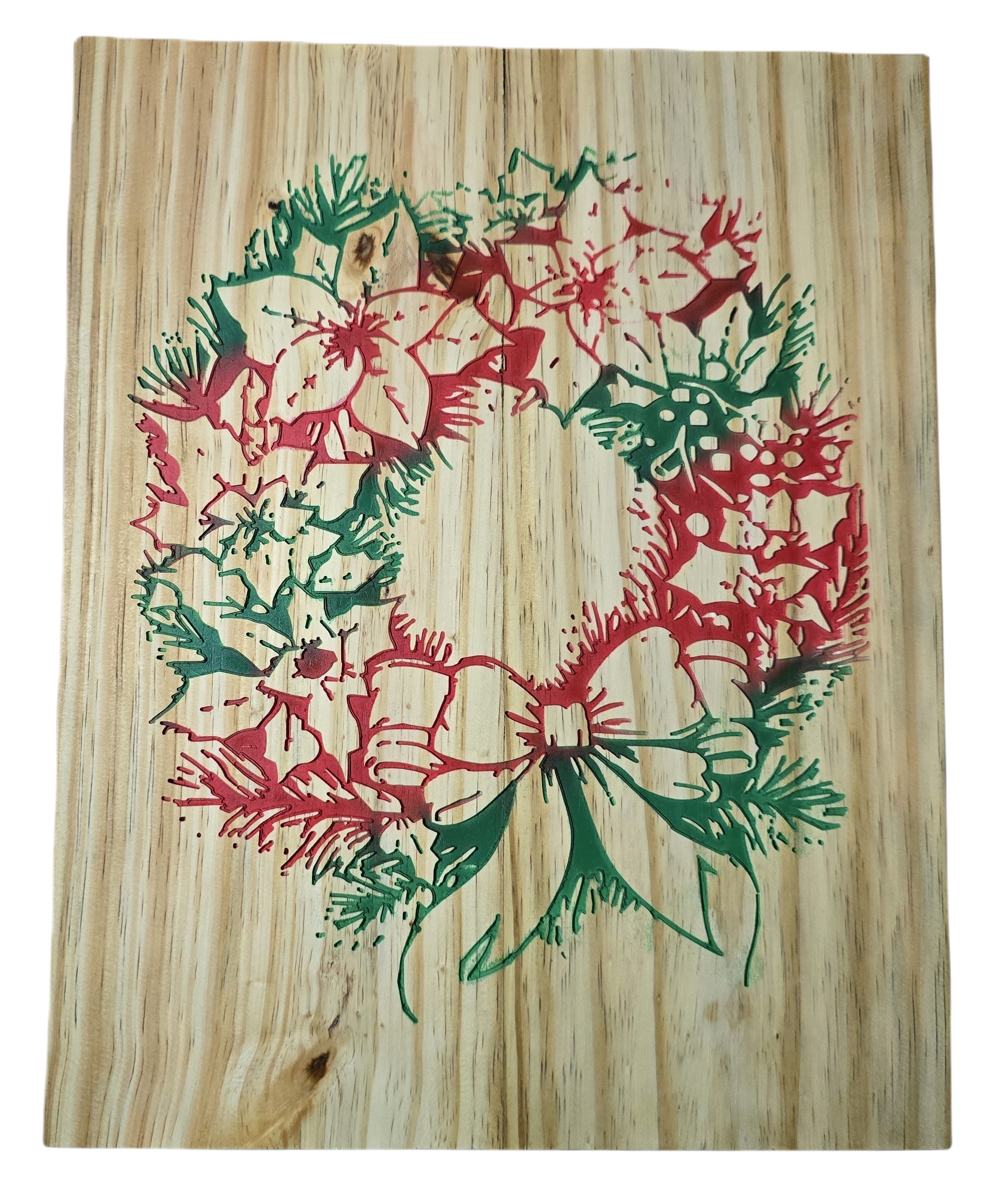 TK Wood Designs rustic Christmas wreath carved into wood, featuring red poinsettias and green pine needles with a bow.