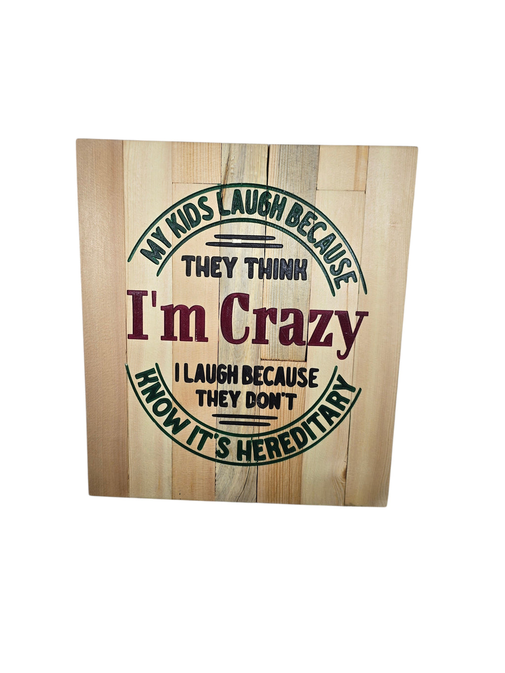 TK Wood Designs rustic wooden sign with the quote 'My kids laugh because they think I'm crazy. I laugh because they don't know it's hereditary.'