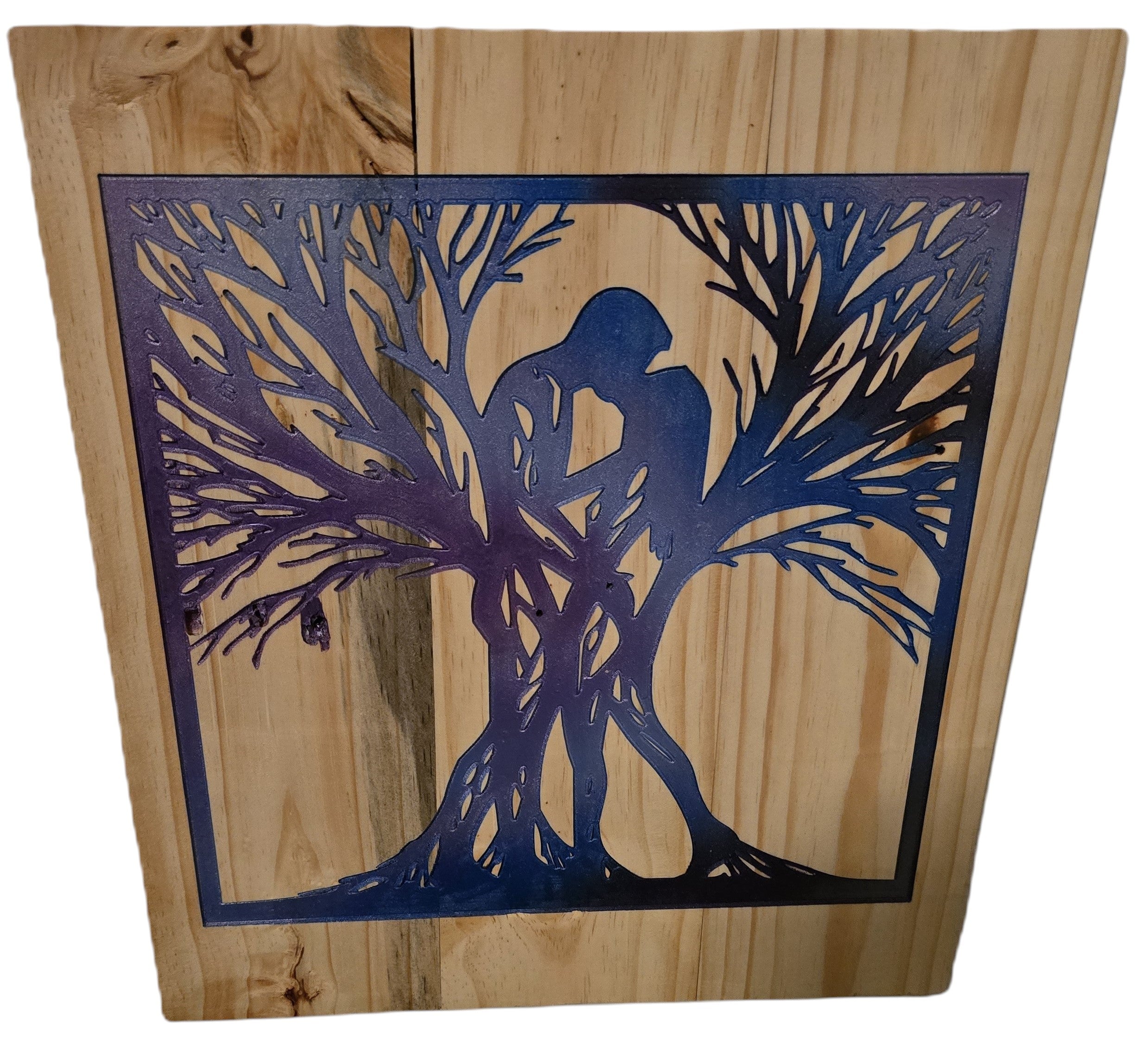 TK Wood Designs Embracing Tree Silhouette Wall Art, natural wood with gradient blue/purple metal cutout of intertwined figures in a tree.