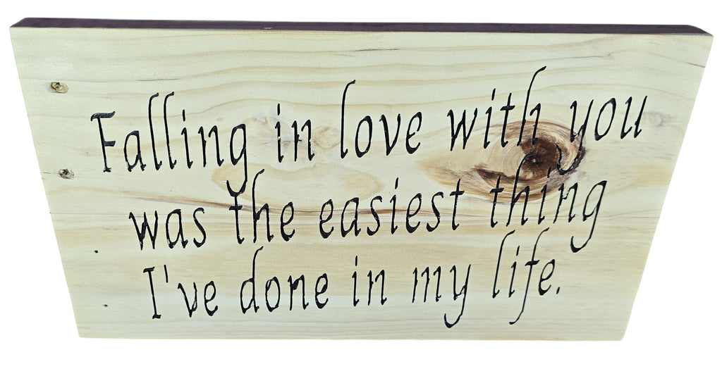 TK Wood Designs natural wood sign with black script: "Falling in love with you was the easiest thing I've done in my life."