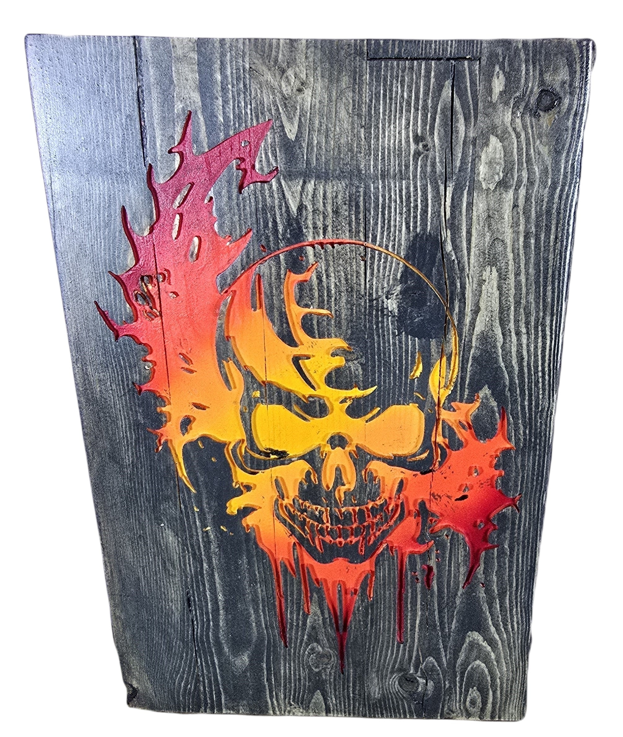 TK Wood Designs distressed wood wall art featuring a fiery skull in red, orange, and yellow. Rustic texture.